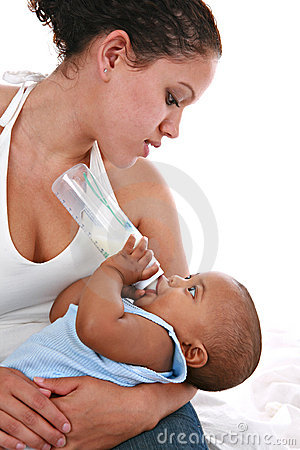 happy-mother-feeding-baby-boy-milk-bottle-7703765